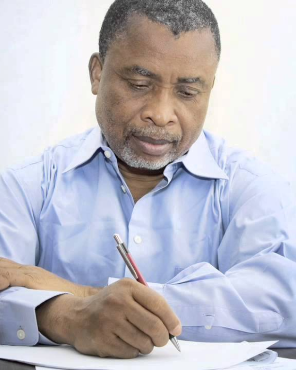mature afro american man makes notes on paper  sugarcoupling.com