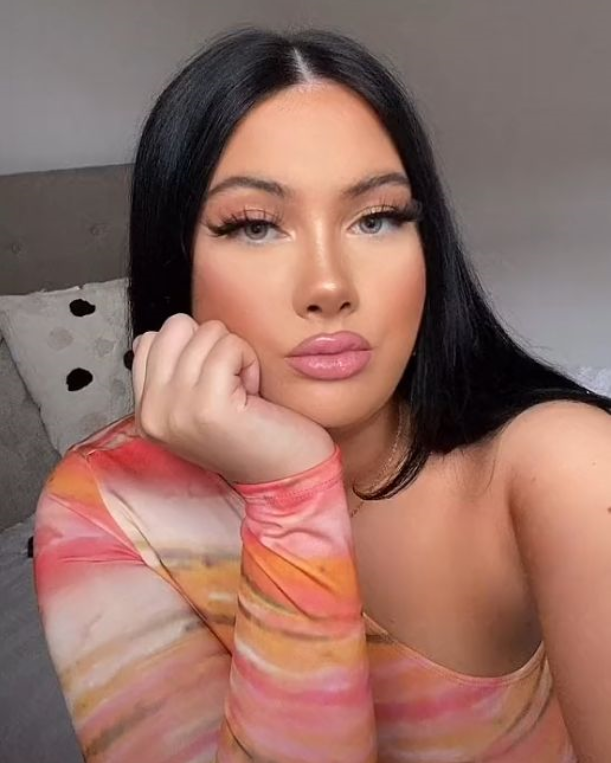 sultry beautiful woman looks at camera  sugarcoupling.com